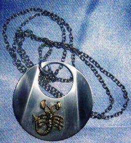 Taurus necklace on blue background