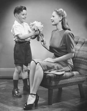 Mother getting flowers from son
