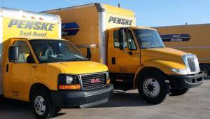 two Penske trucks