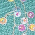 zodiac necklace vintage metal on aquamarine background